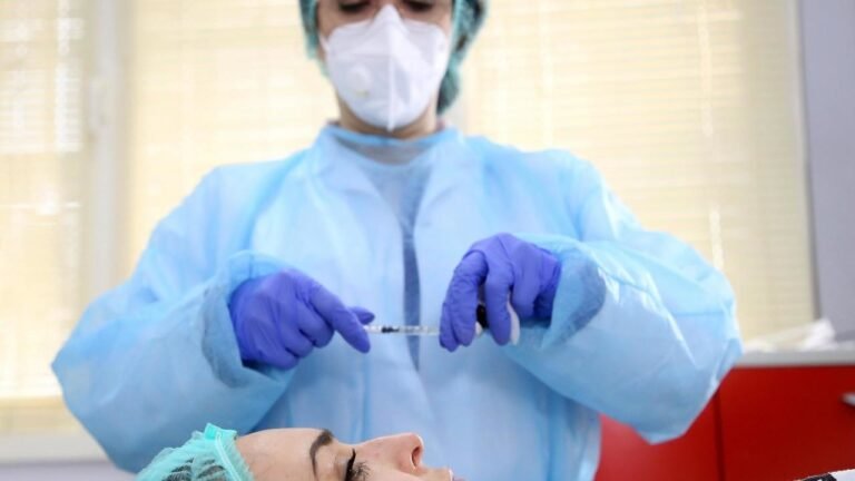 Nip, tuck, mask: cosmetic surgery sweeps Albania along with virus