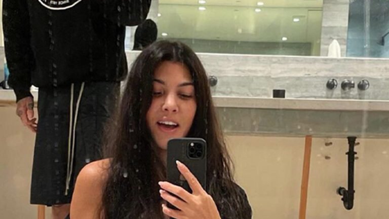 Kourtney Kardashian shows off her bare breast in NSFW photo with Travis Barker as fans slam their ‘excessive’ PDA