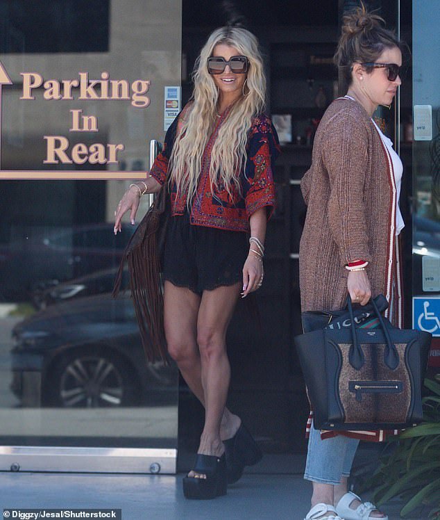 Jessica Simpson puts her incredibly toned legs on full display in black lace shorts in LA