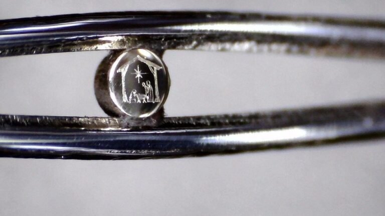 Tiny Nativity scene in the eye of a needle on display in Birmingham